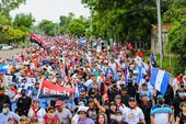 Nicaraguans celebrating the 43rd anniversary of the Revolution